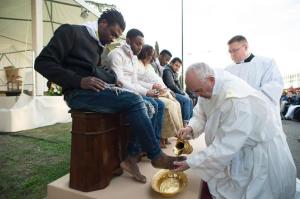 In this handout picture released by the Vatican Press Office, Pope Francis performs the foot-washing ritual at the Castelnuovo di Porto refugees center near Rome on March 24, 2016. Pope Francis washed the feet of 11 young asylum seekers and a worker at their reception centre to highlight the need for the international community to provide shelter to refugees. Several of the asylum seekers, one holding a baby in her arms, were reduced to tears as the 79-year-old pontiff kneeled before them, pouring water over their feet, drying them with a towel and bending to kiss them. / AFP PHOTO / STR / RESTRICTED TO EDITORIAL USE - MANDATORY CREDIT "AFP PHOTO / OSSERVATORE ROMANO" - NO MARKETING NO ADVERTISING CAMPAIGNS - DISTRIBUTED AS A SERVICE TO CLIENTS STR/AFP/Getty Images